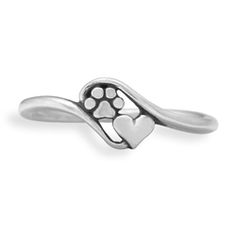 a silver ring with a paw and heart on it