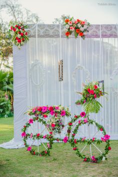 a bicycle decorated with flowers and greenery for a wedding ceremony in the park or garden