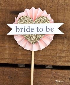 a pink lollipop with the words bride to be on it