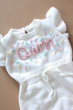 Beautiful birthday hand embroidered romper.  Celebrate your baby's big day with the cutest and happy sprinkles and confetti romper Custom order welcome White Cute Bubble Romper For First Birthday, Cute White Bubble Romper For First Birthday, White Bubble Romper For Spring Cake Smash, White Bubble Romper For Cake Smash In Spring, Sweet White Bubble Romper For Party, Sweet White Bubble Romper For First Birthday, Playful White Bubble Romper For First Birthday, Embroidered Romper, Confetti Sprinkles