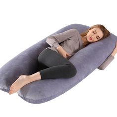 a woman laying on an inflatable pillow