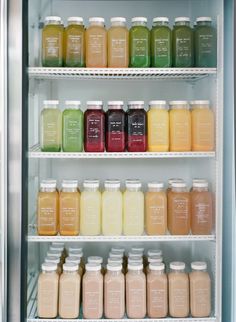 many different types of juices are on shelves