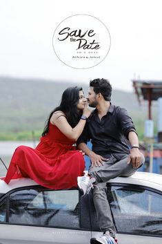 a man and woman sitting on top of a white car with the words save the date above them