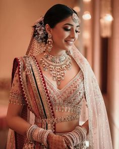 a woman in a bridal outfit and jewelry