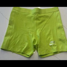 Get Ready To Hit The Gym Or The Beach With These Nwt Women's Tight Fit High-Rise Short Length Shorts In Size Large. Made By Nike, These Shorts Are Perfect For Any Athletic Occasion. They Come In A Bright Lime Color That Will Make You Stand Out From The Crowd. These Shorts Are Designed For Women And Feature A Tight Fit And High-Rise Waist. They Are Made For Gym And Training, Beach, Cycling, Cross Training, Dance, Crossfit, And Cheerleading. With Their Athletic Style, These Shorts Will Showcase Yo Green Above Knee Bottoms With Built-in Shorts, Green Bottoms With Built-in Shorts Above Knee, Green Above-knee Bottoms With Built-in Shorts, Tight Green Bottoms, Nike Green Sportswear Bottoms, Fitted Short Leg Sportswear Bottoms, Nike Fitted Athletic Shorts Mid-thigh Length, Nike Fitted Biker Shorts With Built-in Shorts, Nike Fitted Mid-thigh Athletic Shorts