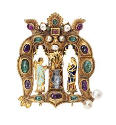 We have the pleasure to present you this amazing Castellani brooch in 18K Gold well decorated with different perfectly fine filigree motifs also on back. Set with foiled cabochon of emeralds, rubies, purple and blue sapphire all in raised gold collets. Moreover is decorated with pearls. The two arches are topped with pliquè-a-jour enamel and contains the two gold cloisonné enamelled figures of the annunciation ( the Virgin Maria and the Angel ). The brooch is a stylized M from the name of Maria. On the back up and down is signed with the Castellani monogram ( the two opposite C ) in circular reserves. This Masterpiece of the Castellani workshop was done in Rome and presented at London Universal Exibition of 1862 with enormous success in the media of that time. 18K Gold. It is in perfect co Medieval Angel, Antique Style Jewelry, The Annunciation, New College, Historical Jewellery, Medieval Jewelry, Gold Brooch, Well Decor, Ancient Jewelry