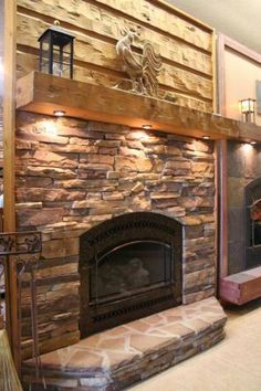 a large stone fireplace in the middle of a room