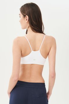 An easy to wear seamless bra designed to go from gym to everyday...seamlessly. Chafe-free fabric lets you move with easy and layers beautifully under any top. BEST FOR: running, yoga, crossfit, barre, pilates, spin class or gym workouts. Model is 5'10" and wears a size XS/S. Sporty Crop Top With Built-in Bra And Minimal Stretch, Compressive Seamless Sports Bra With Built-in Bra, Micro-elastic Crop Top With Built-in Bra For Yoga, Micro-elastic Workout Crop Top With Built-in Bra, Stretch Sports Bra With Removable Pads For Training, Sporty Seamless Sports Bra For Pilates, Athleisure Bra With Removable Pads For Pilates, Sports Bra With Minimal Stretch For Workout, Gym Activewear With Built-in Bra And Minimal Stretch