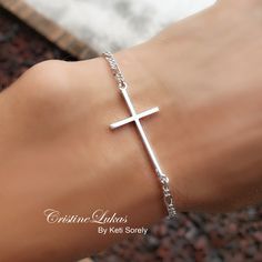 "This stylish sideways cross bracelet will come with sturdy Figaro chain. Bracelet will make a meaningful gift for a confirmation, baptism, Christmas or birthday. Metal options: * Sterling Silver * Sterling Silver with Yellow Gold overlay Cross length: 1\" For solid gold options, please inquire. -------PRODUCTION TIME--------- Please allow 5 business days for production." Adjustable Cross Chain Bracelet As Gift, Adjustable Chain Cross Rosary Bracelet As Gift, Rosary Bracelet With Cross And Adjustable Chain For Gifts, Adjustable Cross Rosary Bracelet As Gift, Silver Cross Chain Bracelet As Gift, Spiritual Cross Charm Bracelet Gift, Elephant Anklet, Bracelet For Man, Bracelet With Cross