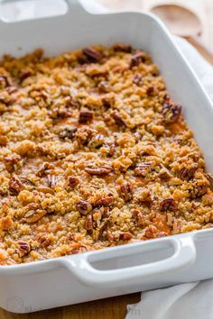 a casserole dish filled with bread and nuts