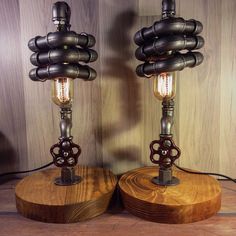 two lamps made out of wood and metal