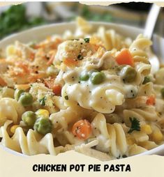 chicken pot pie pasta with peas and carrots in a white bowl on a table