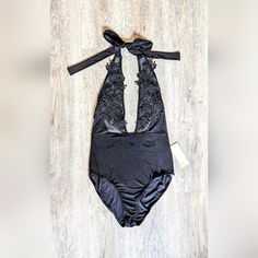 Nwt Sexy Plunging Black Bodysuit. Tie Halter Neckline. The Top Half Is Mesh With Floral Applique Covering The Bust Area. Stretchy Material. No Size On Tag But Fits Like A Medium. Size: Medium Measurements Laid Flat: 12.5" From Start Of Mesh To Waist (Not Including Tie Ribbon) 13" Waist 15.5" Hips Party Halter Neck Swimwear With Stretch, Elegant V-neck Party Swimwear, Glamorous Halter Neck Swimwear For Party, Triangle Top Bodysuit For Club With Lined Body, Triangle Top Bodysuit With Lined Body For Club, Night Out Triangle Top Bodysuit With Lined Body, Triangle Top Lined Bodysuit For Club, Stretch Backless Party Swimwear, Night Out Bodysuit With Triangle Top