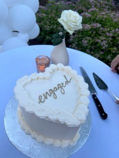 a heart shaped cake sitting on top of a table