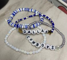 How bout them boys? 🏈 Show your support for your favorite team with this stack of four beaded bracelets! The Cowboys stack comes with 4 bracelets-- two seed bead, one clay heishi bead, and one pearlescent beaded bracelet.  Handmade with love and care and shipped from central Texas 💙🤍 Blue Beaded Bracelets With Letter Beads For Team Spirit, Blue Team Spirit Beaded Bracelets As Gift, Blue Beaded Bracelets For Team Spirit Gift, Perle Heishi, Bracelet Stuff, Football Bracelet, Preppy Bracelets, Bracelets Ideas, Friendship Bracelets With Beads