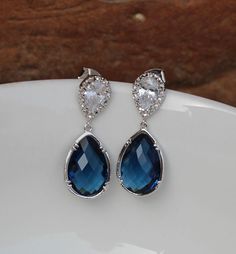 these beautiful earring made of blue glass drop , and finished with sterling silver post . drop Montana earring are 1.5 '' long from top to bottom. cz stone are 18mm for more https://www.etsy.com/shop/arbjewelry Sapphire Dangle Crystal Earrings For Formal Occasions, Sapphire Crystal Dangle Earrings For Formal Events, Sapphire Crystal Dangle Earrings For Formal Occasions, Sapphire Crystal Drop Earrings For Formal Occasions, Elegant Blue Crystal Earrings, Formal Blue Crystal Earrings, Sapphire Drop Earrings For Party, Silver Sapphire Earrings For Wedding, Elegant Sapphire Crystal Dangle Earrings