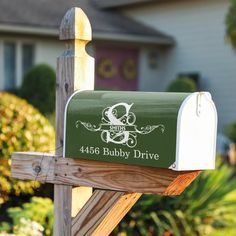 a green mailbox with the number 466 baby drive on it's side