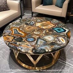 a living room with two couches and a table that has agate stone on it