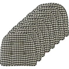 six black and white checkered cloths are lined up in the shape of circles