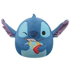 a stuffed animal with an open mouth and wings