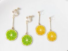 Cute Fruit Lime/Lemon/grapefruit earrings, Dangle Earrings clip-on/stud earrings, gift for her How to choose closure: 🌸Stud-  for Pierced ears: *14k/18k gold plated (ball + bar/or just ball part, will be sent randomly ) +Silver bar part, if you would like a specific kind of them please feel free to contact me. * Comes with a pair of earring back stoppers (metal +rubber, like the photo) * Comes with a polishing cloth, if you pay for gift wrap as well, only one polishing cloth will be added by de Plant Earrings, Planet Earrings, Food Earrings, Vintage Style Earrings, Cute Fruit, Animal Earrings, Silver Bar, Silver Bars, Etsy Earrings Dangle