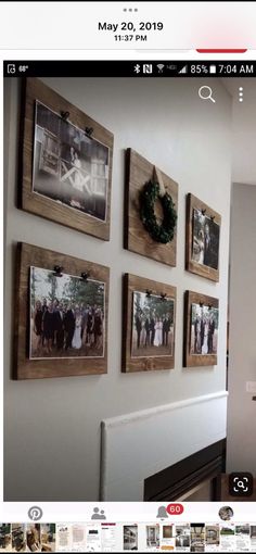 a wall with pictures hanging on it and a fire place in front of the fireplace