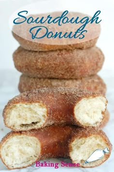 doughnuts stacked on top of each other with the words sourdough donuts above them