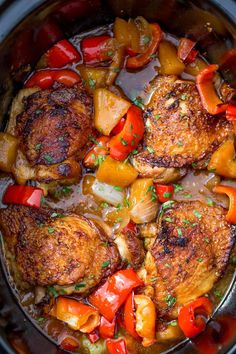 chicken with peppers and onions in a skillet