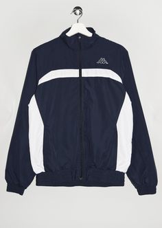 "Vintage Kappa track jacket in navy blue and white. - Size tag: Please always check measurements before buying. Women's M - Measurements (laying flat): Pit to Pit: 21.5\" Length: 26\" Sleeve: 25.5\" Pit to Cuff: 19.5\" Across the shoulders: 17.5\" -Wear: /Please see images for details/ Good vintage condition. -Flaws: / serious wear, tears, holes, marks or stains/  None - Fabric: Polyester *All of our items are preloved pieces so some signs of natural wear and age are to be expected. Please look through the photos carefully to check if the condition is to your satisfaction. *All efforts are made to show any defects however small imperfections may be missed. In cases that we've missed a major flaw, please remember that we are still human and make mistakes, please contact us first so we can w Kappa Jacket, Vintage Track Jacket, Navy Blue Jacket, Vintage Windbreaker, Tomboy Fashion, Kpop Fashion Outfits, White Jacket, Kpop Fashion, Track Jacket