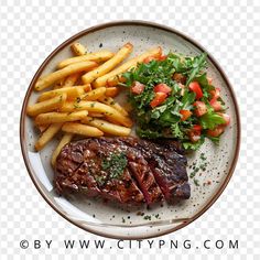 steak and french fries on a plate with lettuce, tomato, and parsley