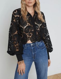 L'Agence Odelia Cropped Lace Blouse in black. Long blouson sleeves. Classic collar. Cropped hem. Boxy fit. Button cuffs. Button front closure. Paisley style lace. Unlined. Sheer. 100% Polyester. .About 19" From Shoulder to Hem Sleeve Length: 24.75". Model Details: Height 5’10.5" | Bust 33" | Waist 24" | Hips 34" | Wearing Size XS. Imported. Multi Millionaire, Pastel Knits, Cropped Button Down, Paisley Fashion, Unique Beach, Knit Denim, Beach Ready, Blouse Outfit, Paisley Design