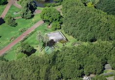 an aerial view of a lush green park