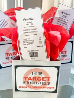 the target with you as a friend sign is in a box filled with red roses