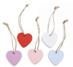 four heart shaped wooden tags hanging from twine string on white background with text that says partigo