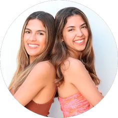 two young women are smiling for the camera