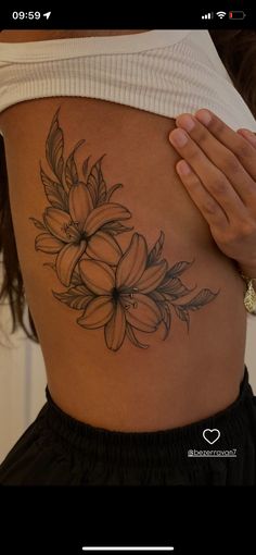 a woman's stomach with flowers on it