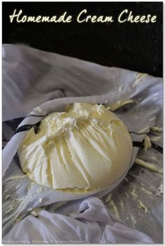 homemade cream cheese on a white plate with the words homemade cream cheese written above it