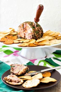 two plates with crackers and meatballs on them