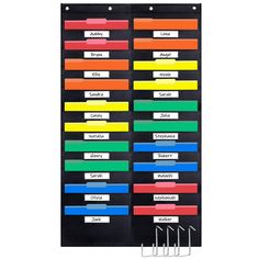 a black board with colored labels and clips on the bottom, in front of a white background