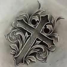 a cross tattoo design on the back of a woman's arm and shoulder,