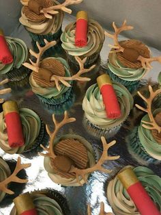 cupcakes decorated with deer antlers and red candles