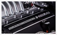 the superchaped hemi logo is on the engine compartment of a car's engine