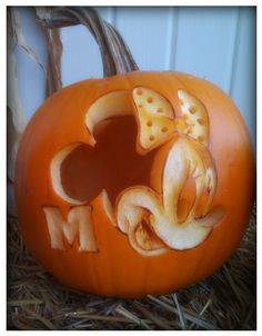 a pumpkin carved to look like a mother's day