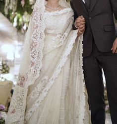 a bride and groom walking down the aisle