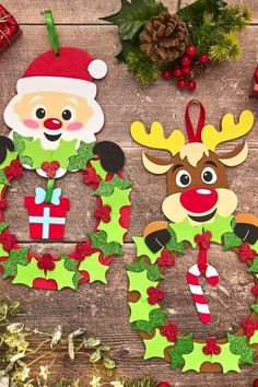 some christmas decorations are laying out on a wooden table with santa claus and reindeers