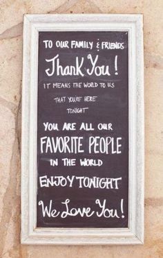 a chalkboard sign on the side of a building that says, to our family & friends thank you it means the world to us