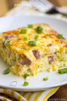 a close up of a plate of food with green onions and egg casserole