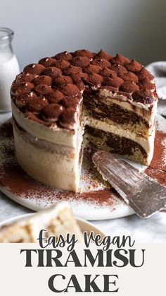 a cake with chocolate frosting on top and the words easy vegan tiramsu cake above it