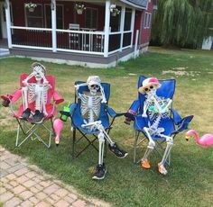 three lawn chairs with skeletons sitting on them