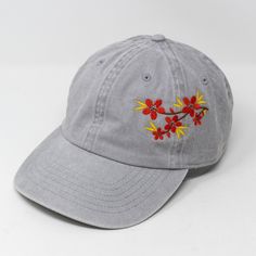 Cotton Baseball Cap With Floral Embroidery, Floral Embroidery Cotton Snapback Hat, Cotton Floral Embroidery Snapback Hat, Cotton Snapback Hat With Floral Embroidery, Floral Embroidered Cotton Baseball Cap, Embroidered Cotton Dad Hat, Cotton Baseball Cap With Embroidered Curved Visor, Adjustable Embroidered Cotton Hat, Cotton Baseball Cap With Embroidered Patch